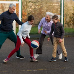 full-shot-family-playing-basketball